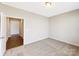 View down a hallway with light brown wood flooring at 1165 Coppergate Dr # 56, Salisbury, NC 28147