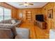 Living room with wood paneled walls, hardwood floors, and built in shelving at 6050 Mcconnells Hwy, McConnells, SC 29726