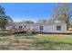 Backyard view of a house showcasing a large deck, lawn and AC unit at 2315 Circle Dr, Great Falls, SC 29055