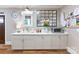 Organized drop zone with cabinets, a built-in bench, and a utility sink at 534 Coman Ln, Kings Mountain, NC 28086