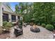 Peaceful patio with fire pit, comfortable seating, and lush landscaping at 534 Coman Ln, Kings Mountain, NC 28086
