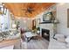 Relaxing sunroom with fireplace, hardwood floors, and ample natural light at 534 Coman Ln, Kings Mountain, NC 28086