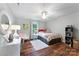 Cozy bedroom with a twin-size bed, desk area, and hardwood floors at 534 Coman Ln, Kings Mountain, NC 28086