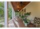 Spacious front porch with wooden ceiling, ceiling fan and potted plants at 534 Coman Ln, Kings Mountain, NC 28086