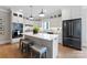 Modern kitchen featuring white cabinets, a large island, and stainless steel appliances at 534 Coman Ln, Kings Mountain, NC 28086