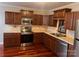 Modern kitchen with stainless steel appliances and wood floors at 300 N Fulton St # 11, Salisbury, NC 28144