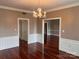 Elegant dining room featuring hardwood floors and a chandelier at 300 N Fulton St # 11, Salisbury, NC 28144