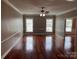 Bright living room with hardwood floors and a ceiling fan at 300 N Fulton St # 11, Salisbury, NC 28144