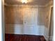 Inviting entryway with hardwood floors and white door at 300 N Fulton St # 11, Salisbury, NC 28144
