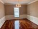 Bright dining room with hardwood floors and chandelier at 300 N Fulton St # 11, Salisbury, NC 28144
