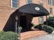 Brick building with awning and steps leading to entrance at 300 N Fulton St # 11, Salisbury, NC 28144