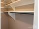 Spacious closet with built-in shelves and hanging rod at 300 N Fulton St # 11, Salisbury, NC 28144