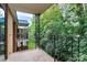 Private balcony overlooking lush trees and greenery at 4754 Hedgemore Dr # T, Charlotte, NC 28209
