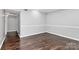 Spacious bedroom featuring hardwood floors and large windows at 4754 Hedgemore Dr # T, Charlotte, NC 28209