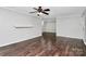 Living room with dark hardwood floors and fireplace at 4754 Hedgemore Dr # T, Charlotte, NC 28209