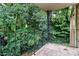 Private balcony with wrought-iron railing and wooded views at 4754 Hedgemore Dr # T, Charlotte, NC 28209