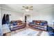 Bright living room with hardwood floors and two leather sofas at 115 Abernathy St, Mount Holly, NC 28120
