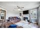 Spacious living room featuring a fireplace and comfortable leather sofas at 115 Abernathy St, Mount Holly, NC 28120