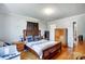 Spacious bedroom with hardwood floors, a large bed, and ample closet space at 115 Abernathy St, Mount Holly, NC 28120