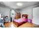 Cozy bedroom with a twin bed, wooden armoire, and window coverings at 115 Abernathy St, Mount Holly, NC 28120