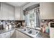 Kitchen with gray cabinets, updated countertops and sink at 115 Abernathy St, Mount Holly, NC 28120