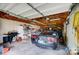 Garage interior with a car, shelves, and various tools at 115 Abernathy St, Mount Holly, NC 28120