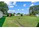 Large backyard with playset, shed, and expansive grassy area at 115 Abernathy St, Mount Holly, NC 28120