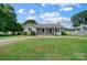 Ranch-style house with covered porch and lawn at 115 Abernathy St, Mount Holly, NC 28120