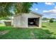 Single-car garage with an open door, revealing a car inside at 115 Abernathy St, Mount Holly, NC 28120