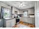 Modern kitchen with gray cabinets and stainless steel appliances at 115 Abernathy St, Mount Holly, NC 28120