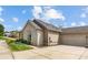 Single-story home with stone accents and a two-car garage at 4759 Polo Gate Blvd, Charlotte, NC 28216