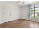 Simple bedroom with hardwood floors and a window with natural light at 4759 Polo Gate Blvd, Charlotte, NC 28216