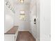 Bright entryway with built-in bench and hooks at 4759 Polo Gate Blvd, Charlotte, NC 28216