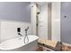 Modern bathroom with a walk-in shower and patterned tile detail at 4759 Polo Gate Blvd, Charlotte, NC 28216