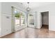 Bright dining room with hardwood floors and large windows offering natural light at 4759 Polo Gate Blvd, Charlotte, NC 28216