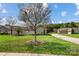 Stone and siding exterior with lush landscaping and private backyard at 4759 Polo Gate Blvd, Charlotte, NC 28216