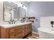 Elegant bathroom with double vanity, soaking tub, and walk-in shower at 4759 Polo Gate Blvd, Charlotte, NC 28216