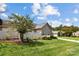 Landscaped yard with stone and siding home; private backyard at 4759 Polo Gate Blvd, Charlotte, NC 28216