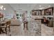 Open kitchen with granite counters and breakfast bar at 18641 Harborside Dr, Cornelius, NC 28031