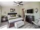 Main bedroom with king bed, ensuite bathroom access, and a large TV at 18641 Harborside Dr, Cornelius, NC 28031