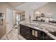 Kitchen features granite countertops, dark cabinetry, and a breakfast bar at 18641 Harborside Dr, Cornelius, NC 28031