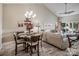 Combined dining and living area with hardwood floors at 18641 Harborside Dr, Cornelius, NC 28031