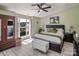 Spacious bedroom with king-size bed, large window, and ceiling fan at 18641 Harborside Dr, Cornelius, NC 28031