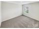 Bright bedroom with neutral walls and carpet at 598 Shellbark Dr, Concord, NC 28025