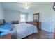 Bright bedroom with a double bed, dresser, and plenty of natural light at 7125 Bisaner St, Charlotte, NC 28269