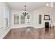 Bright dining room with hardwood floors and access to a screened porch at 625 Highland Ridge Pt, Clover, SC 29710