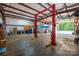 Spacious shop interior with car lift and storage at 4215 Goodson Rd, Maiden, NC 28650