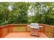 Back deck with grill, overlooks a wooded backyard at 133 Ole Eastpointe Dr, York, SC 29745