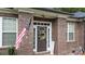 Brick home with a welcoming front door, wreath, and American flag at 133 Ole Eastpointe Dr, York, SC 29745