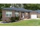 Brick ranch home with a two-car garage and landscaped yard at 133 Ole Eastpointe Dr, York, SC 29745